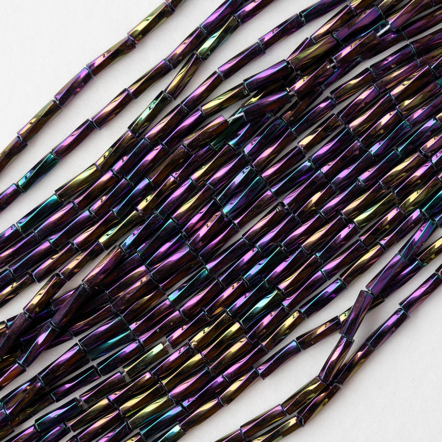 7mm Twisted Bugle Beads - Metallic Purple Iris - 20 inch strand ~80 beads