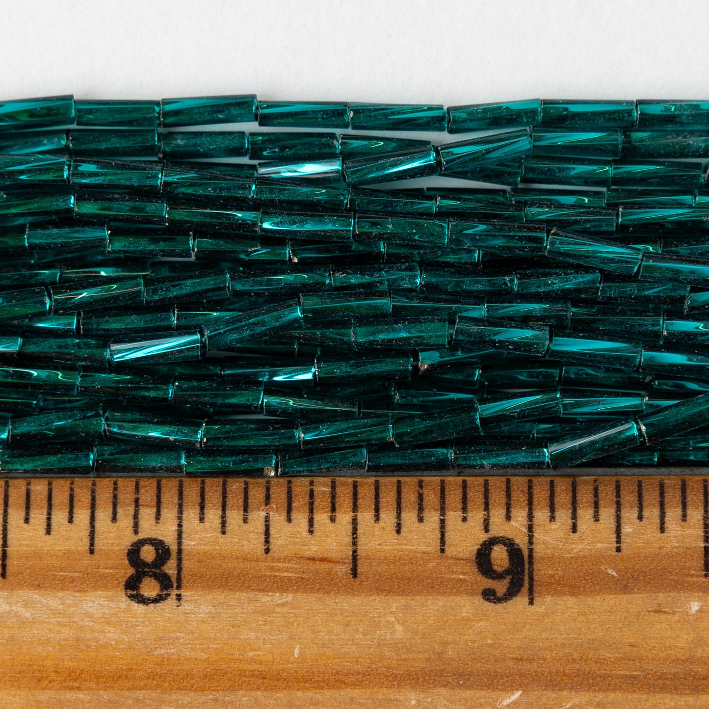 7mm Twisted Bugle Beads - Metallic Teal - 20 inch strand ~80 beads