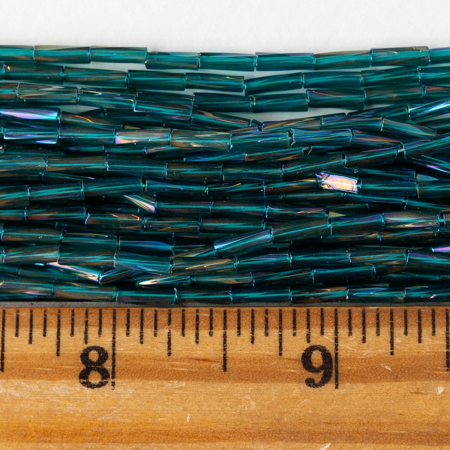 7mm Twisted Bugle Beads - Metallic Teal AB - 20 inch strand ~80 beads