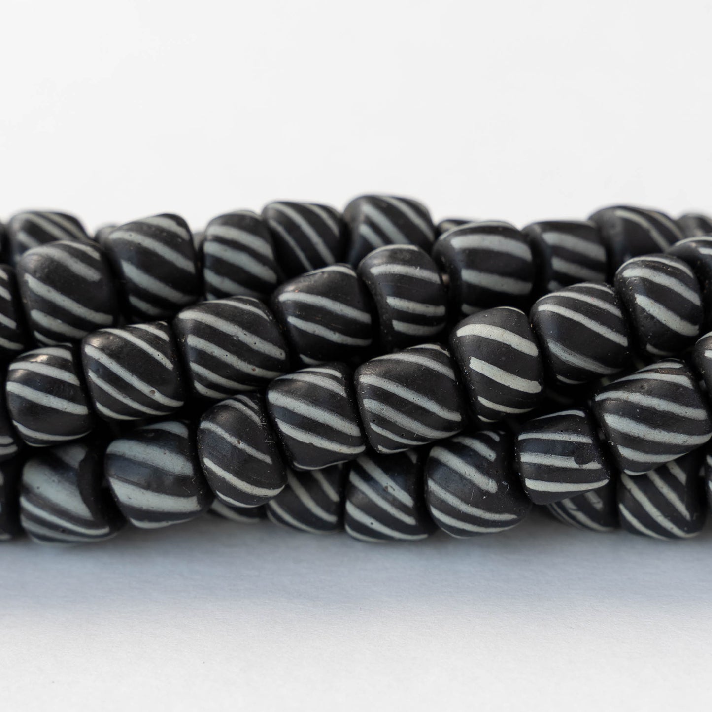 8mm Java Tube Beads - Black with White Stripes - Whole or Half Strand