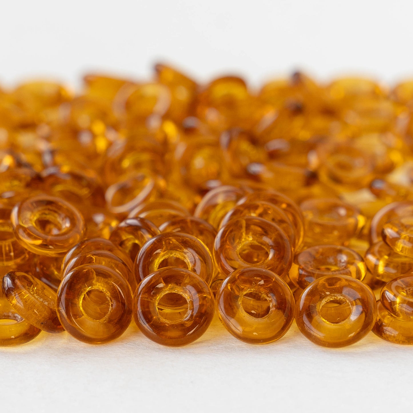 8mm Glass Ring Beads - Transparent Amber - 50 or 100