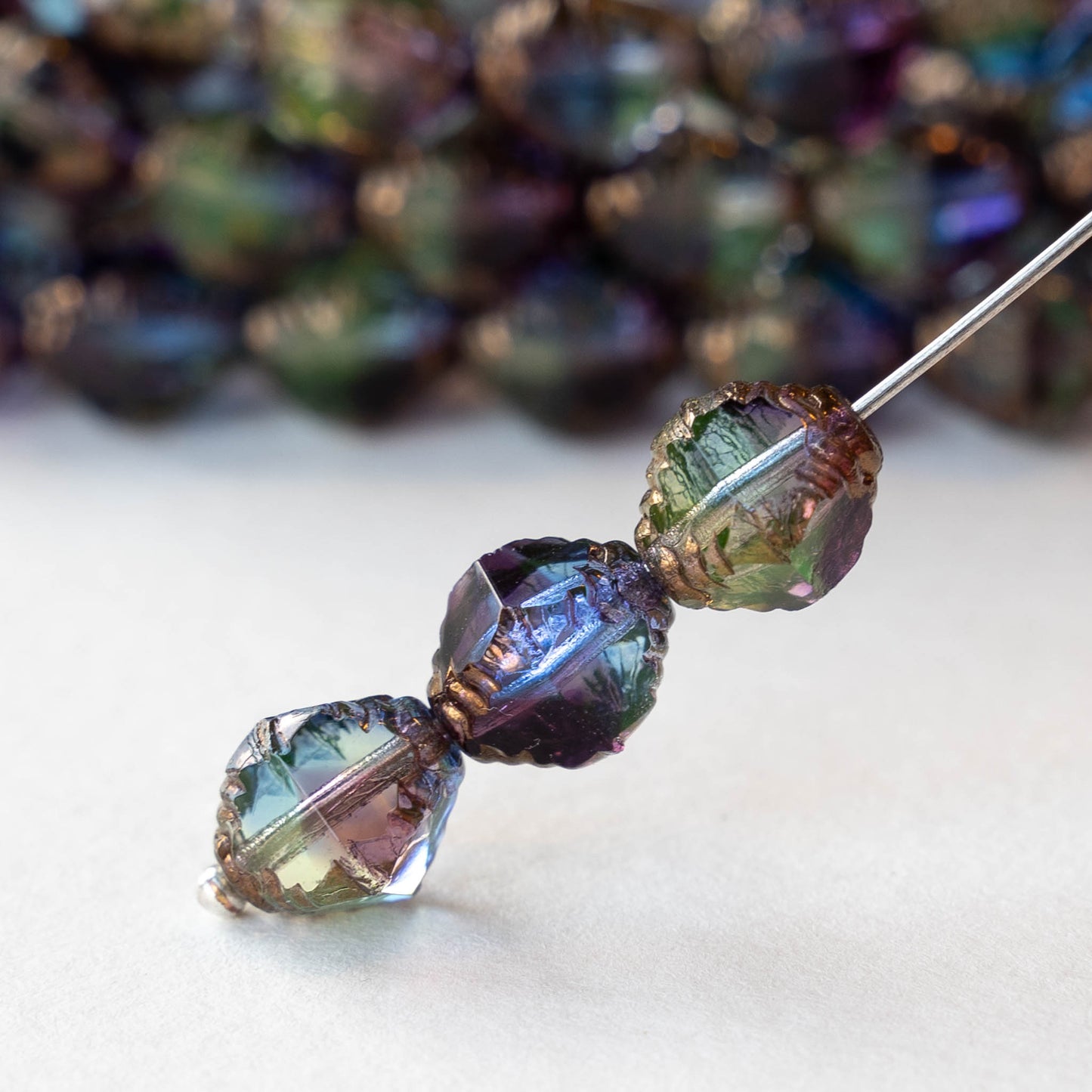 8x10mm Faceted Bicone - Transparent Blue, Purple and Green Bronze - 10 Beads