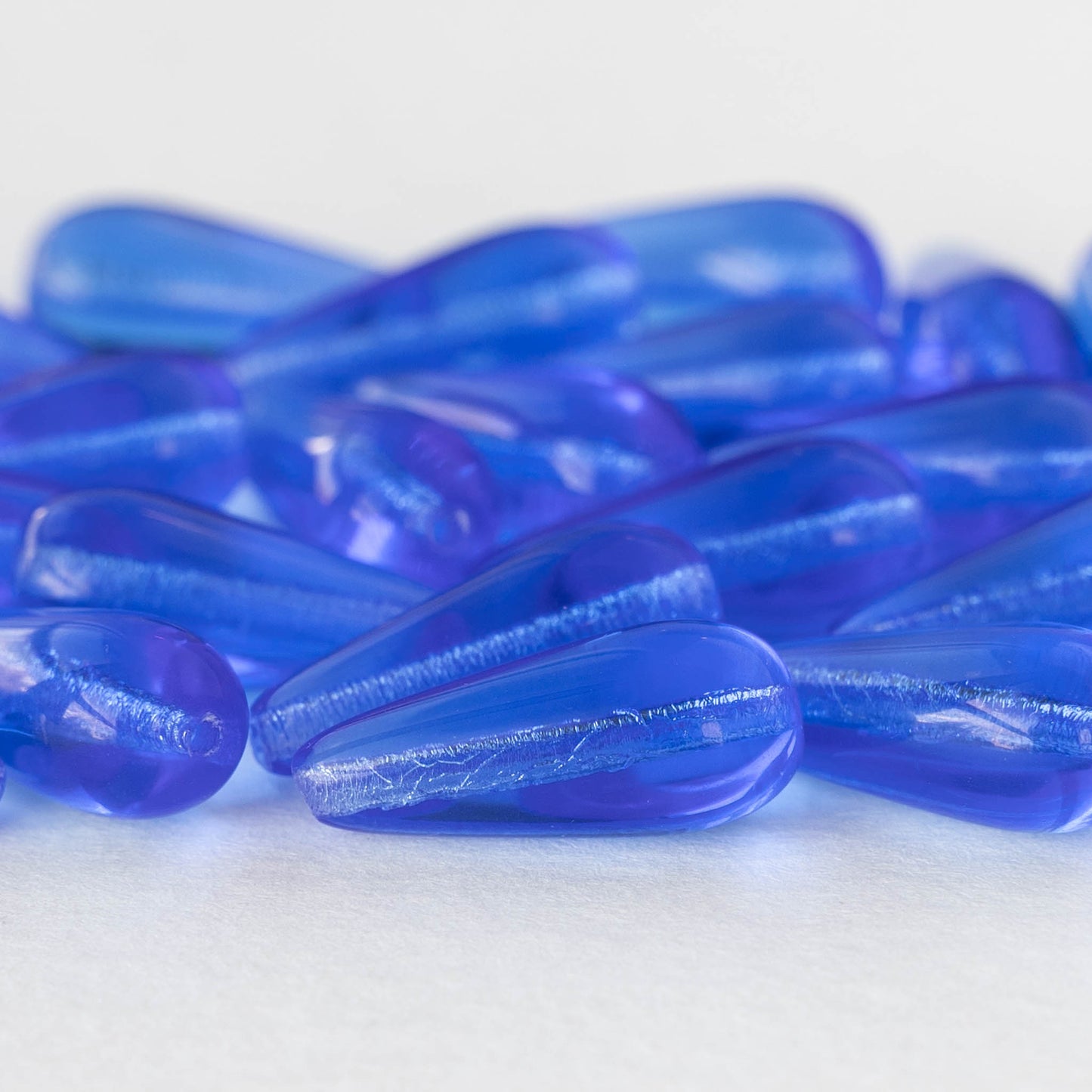 C3628 Czech Glass Teardrop Beads PALE BLUE & HYACINTH 5x7mm - 9599