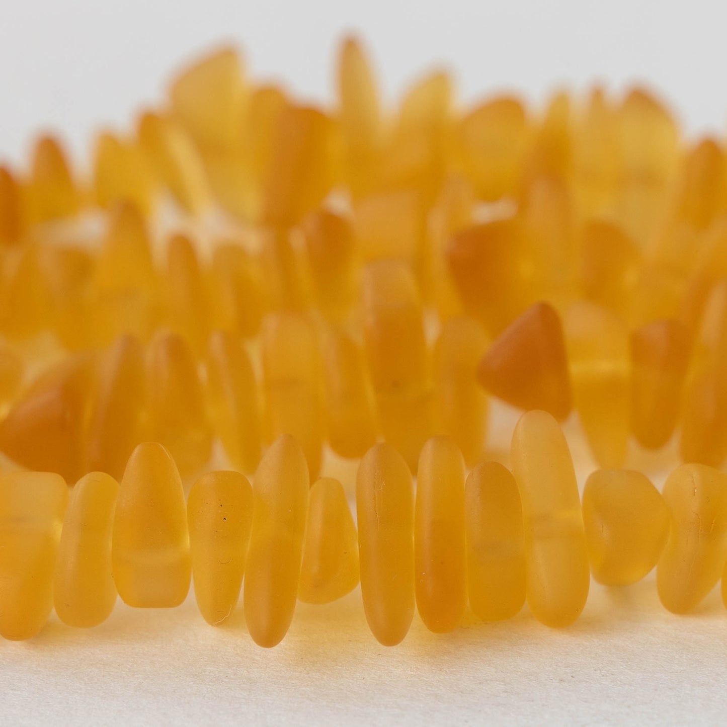 Frosted Glass Pebbles - Amber Topaz - 50 Beads