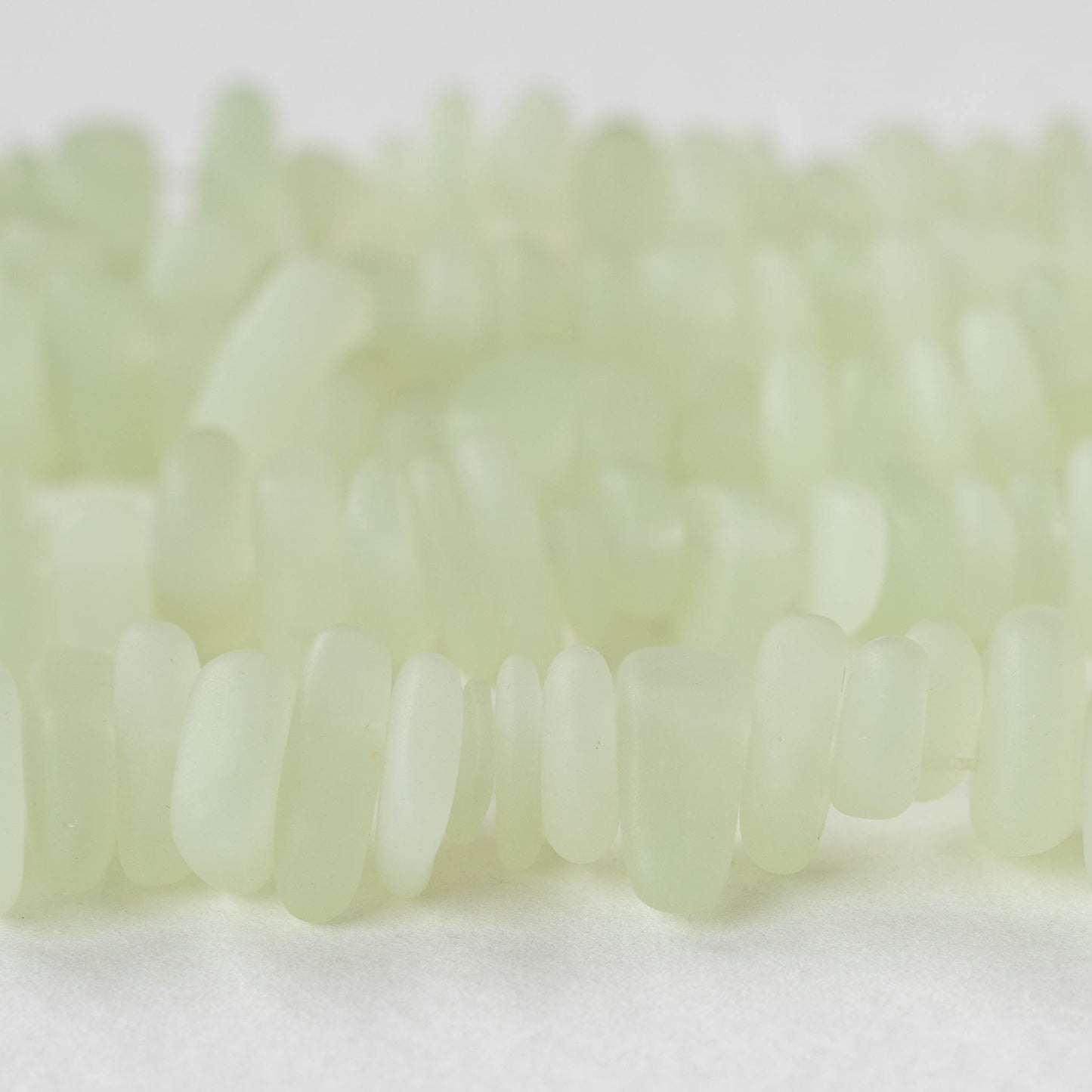 Load image into Gallery viewer, 8-13mm Frosted Glass Pebbles - Very Light Green ~ 50 Beads
