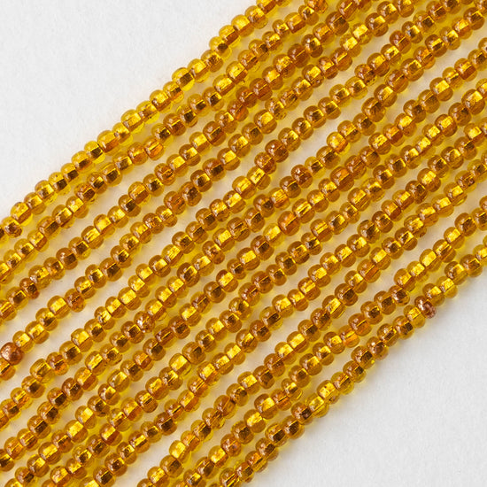 11/0 Glass Seed Beads - Copper Lined Citrine - 20 inch strands - Whole or Half hank
