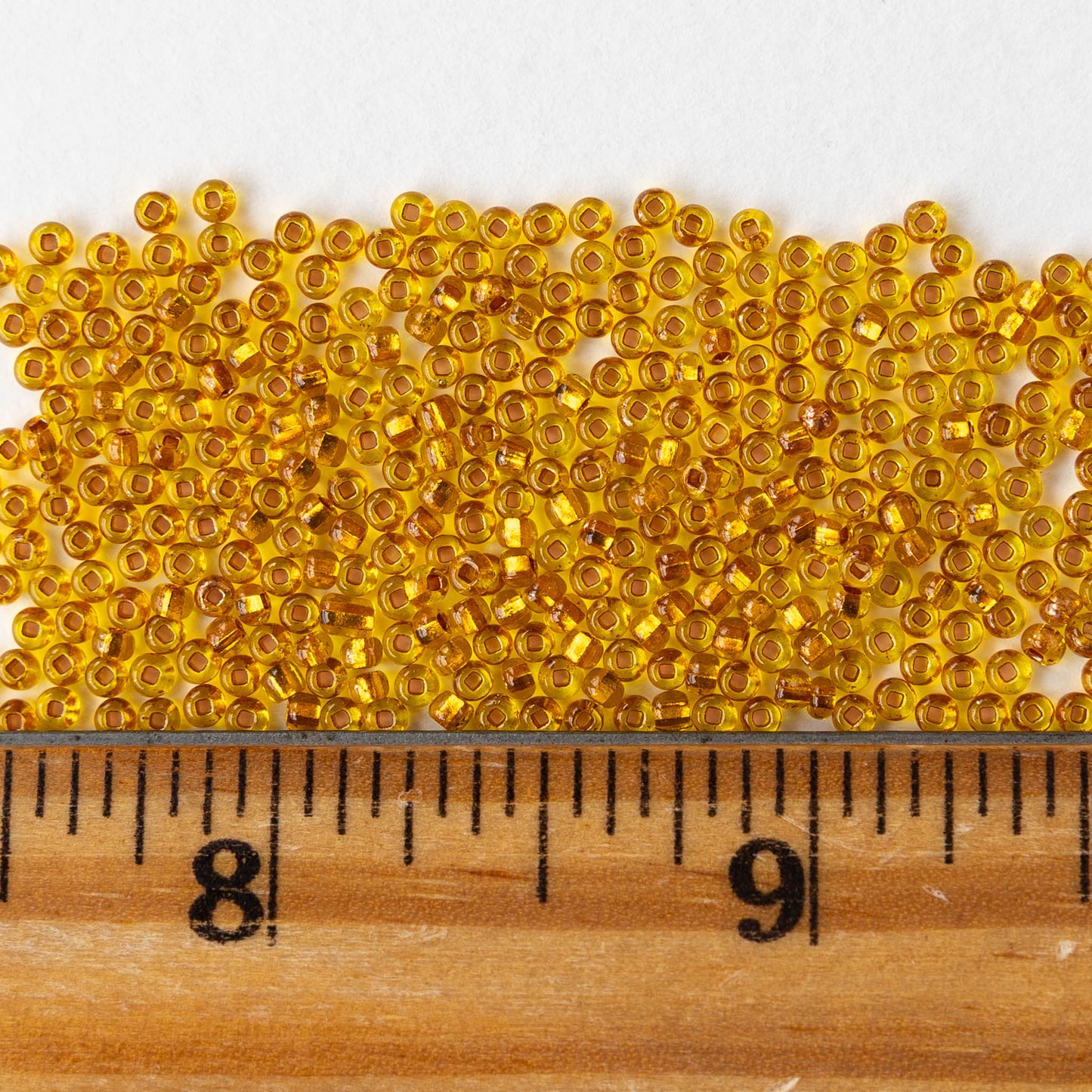 11/0 Glass Seed Beads - Copper Lined Citrine - 20 inch strands - Whole or Half hank