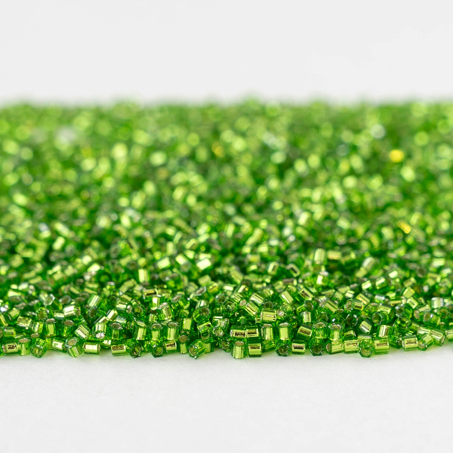 15/0 Glass Hex Cut Seed Beads - Silver Lined Peridot - 10 grams