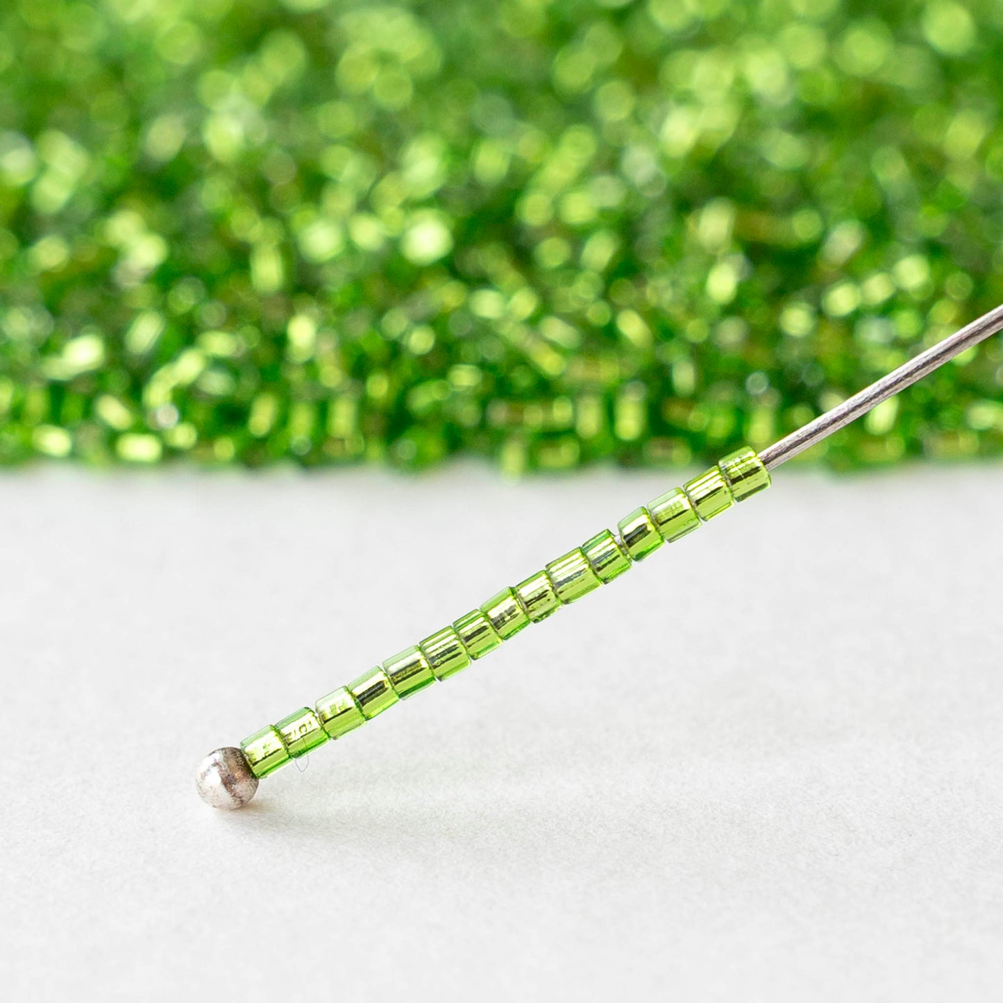 15/0 Glass Hex Cut Seed Beads - Silver Lined Peridot - 10 grams