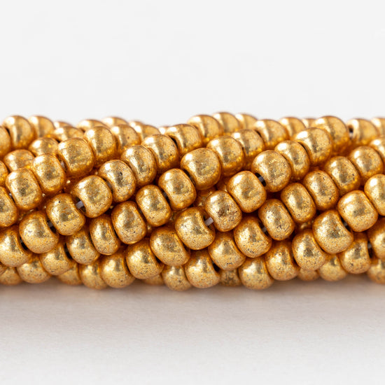 6/0 Glass Seed Beads - Opaque Gold Metallic - 20 inch strands - 1 or 3 strands