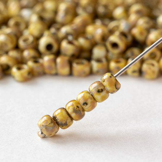 Size 6/0 Glass Seed Beads - Opaque Ivory Picasso - 10 grams ~135 beads