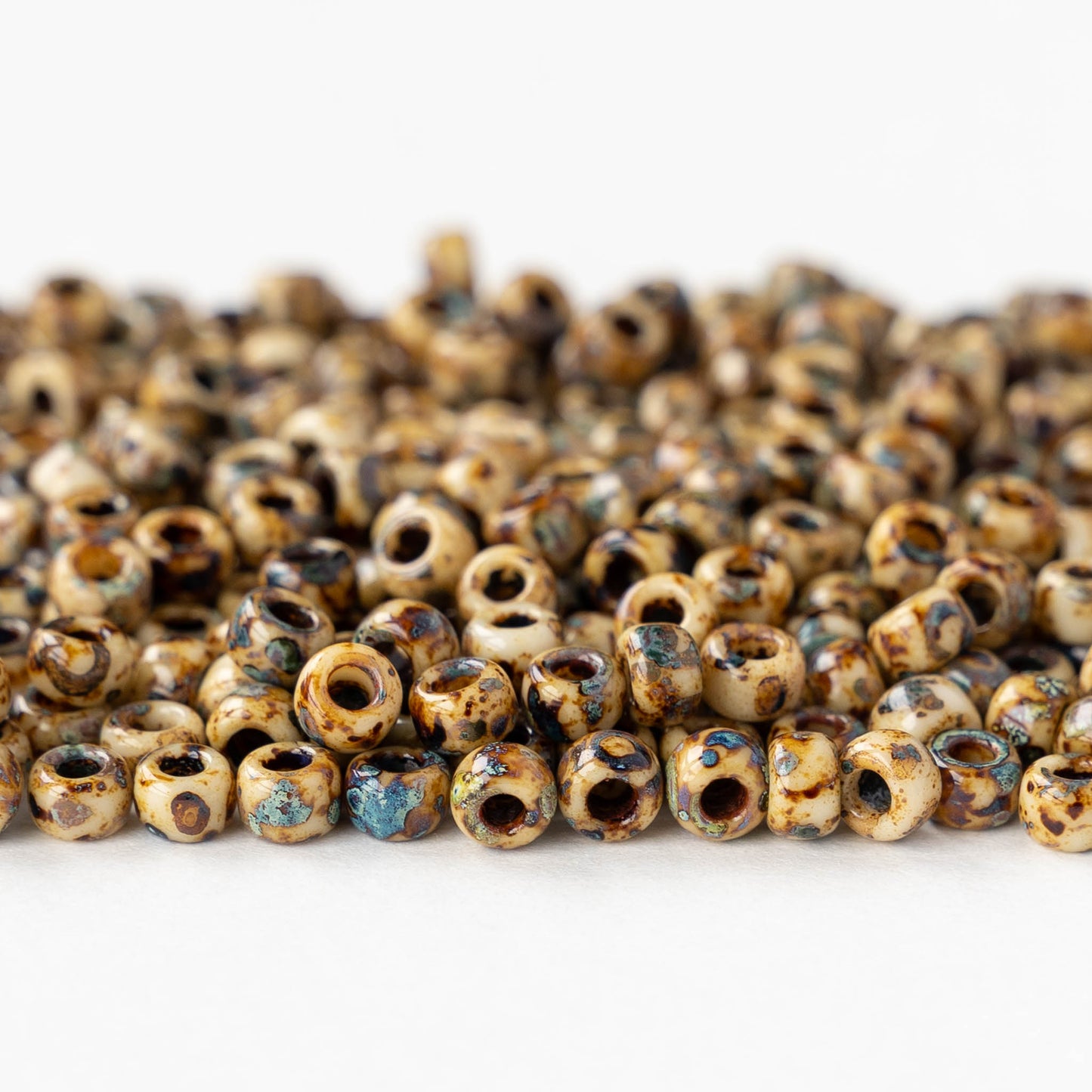 Size 6/0 Glass Seed Beads - Opaque Ivory Picasso - 10 grams