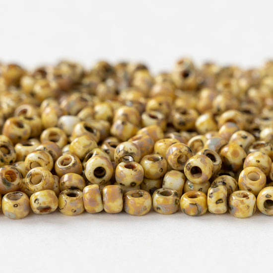 Size 6/0 Glass Seed Beads - Opaque Ivory Picasso - 10 grams ~135 beads