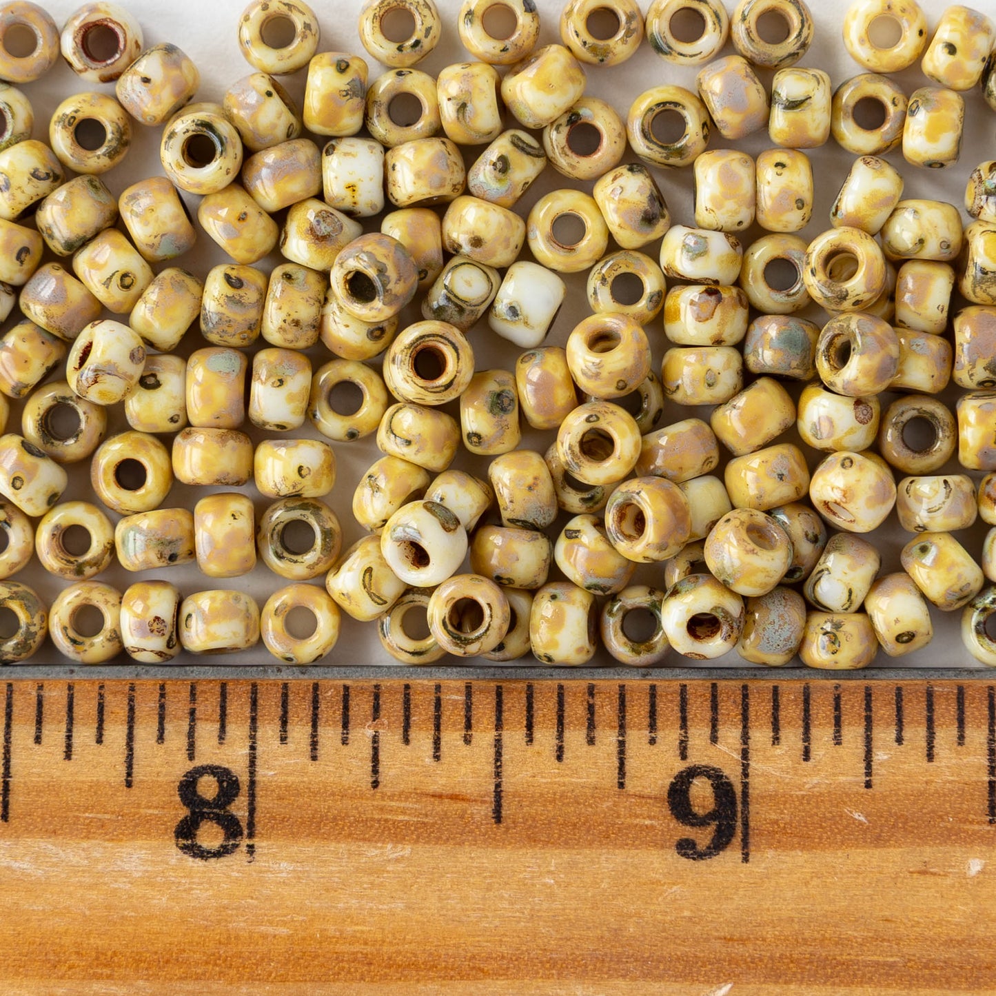 Size 6/0 Glass Seed Beads - Opaque Ivory Picasso - 10 grams ~135 beads