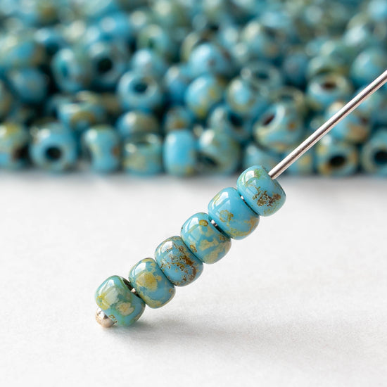 Size 6/0 Glass Seed Beads - Opaque Turquoise Picasso - 10 grams