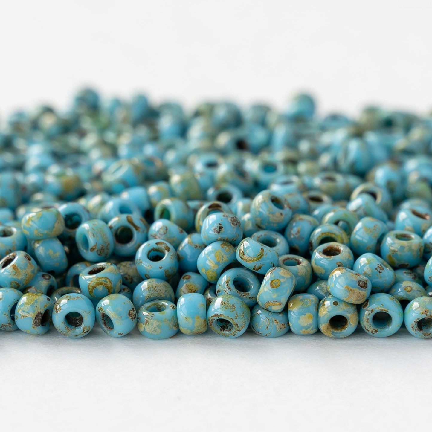 Size 6/0 Glass Seed Beads - Opaque Turquoise Picasso - 10 grams