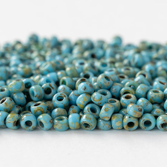 Size 6/0 Glass Seed Beads - Opaque Turquoise Picasso - 10 grams