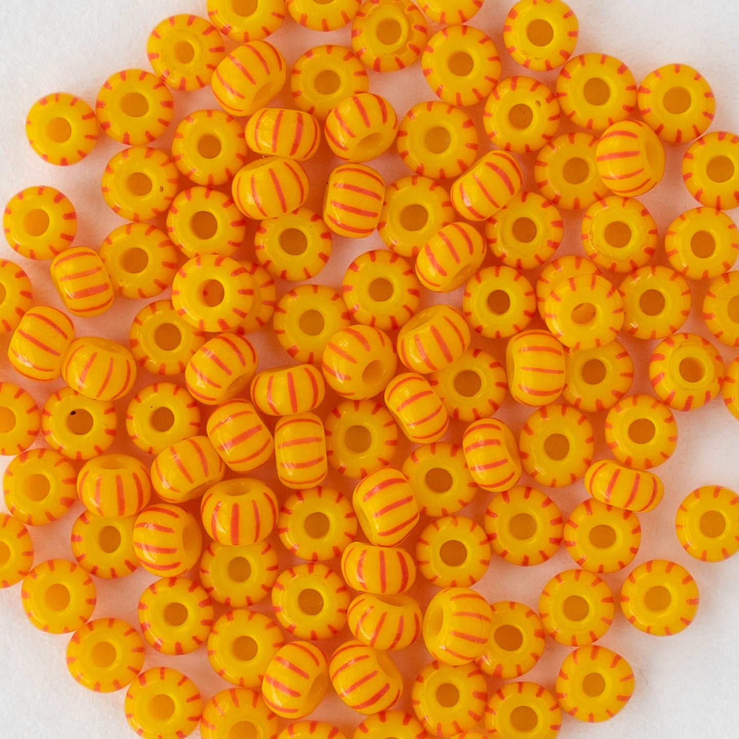 Size 6/0 Glass Seed Beads - Opaque Yellow with Orange Stripes - 20 inch strand