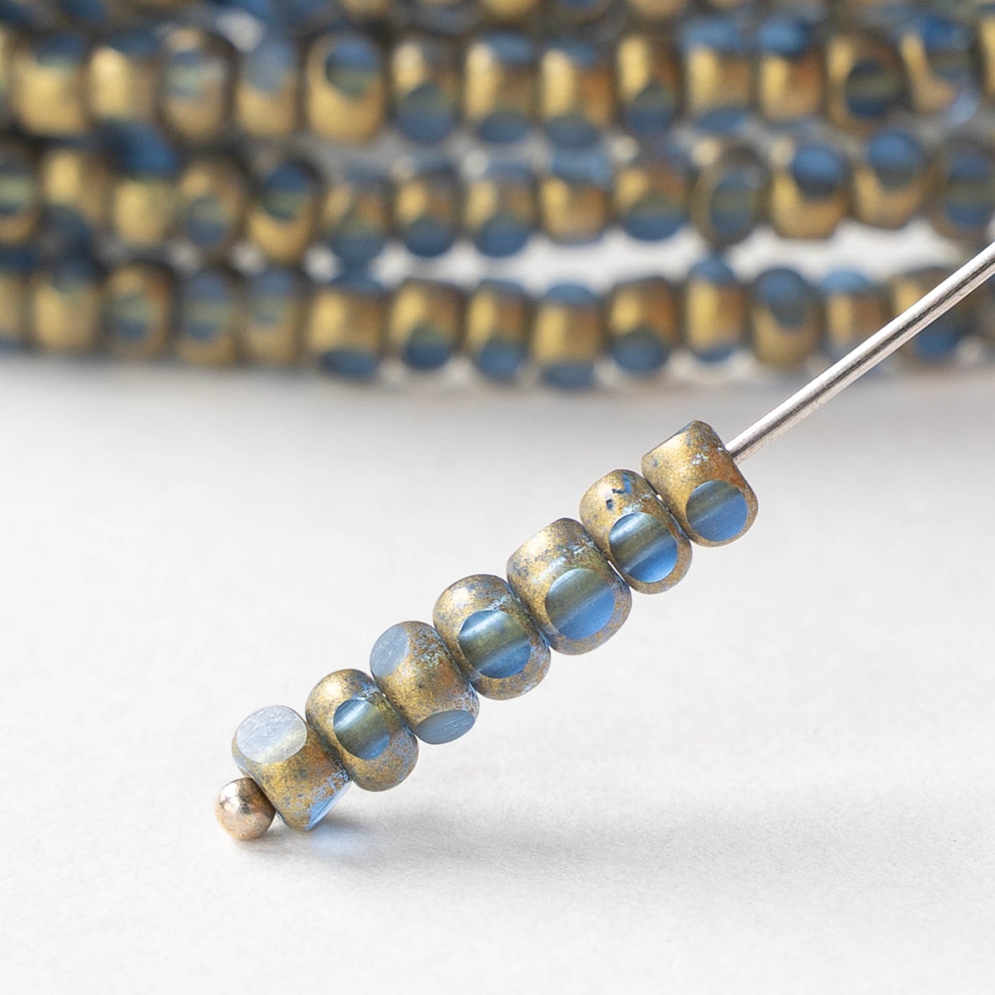 6/0 Tri-cut Seed Beads - Light Sapphire with Bright Gold - 50 Beads