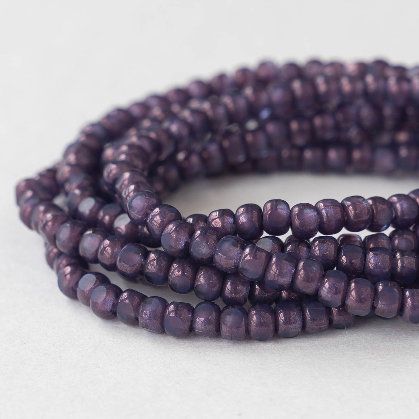 Load image into Gallery viewer, 6/0 Tri-Cut Seed Beads - Purple Luster - 50
