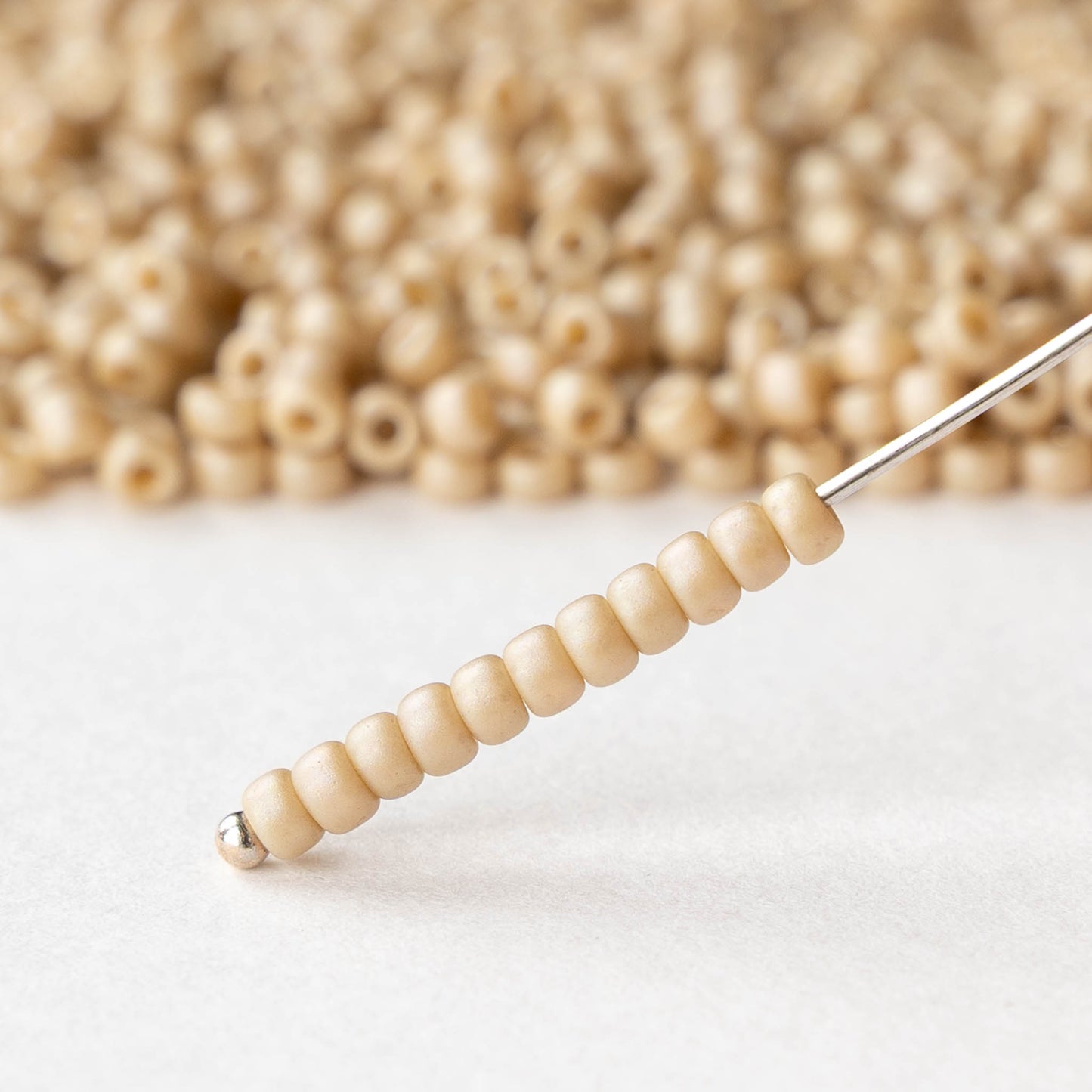 Size 8/0 Glass Seed Beads - Ivory Rainbow - 10 grams