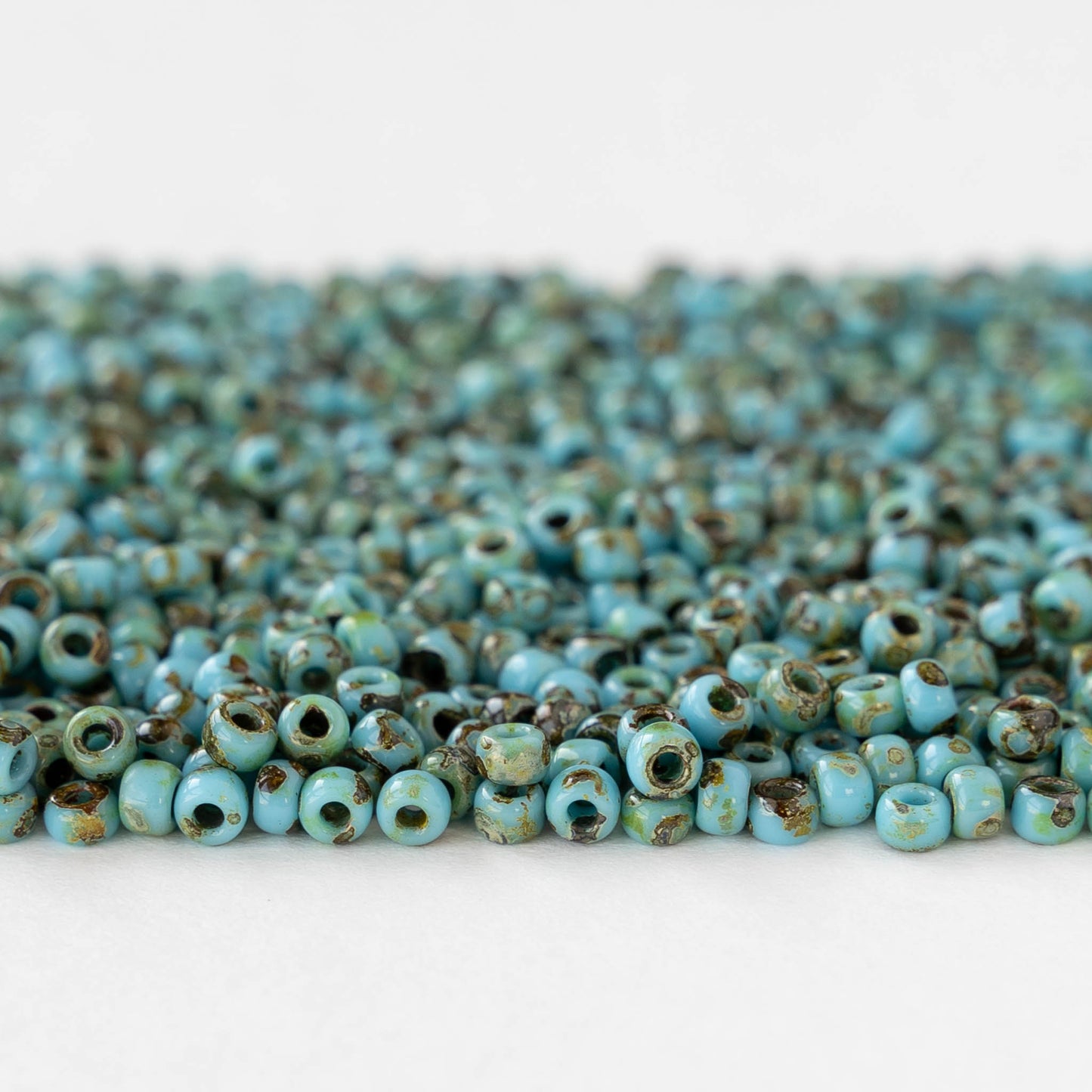 Size 8/0 Glass Seed Beads - Opaque Turquoise Picasso - 10 grams