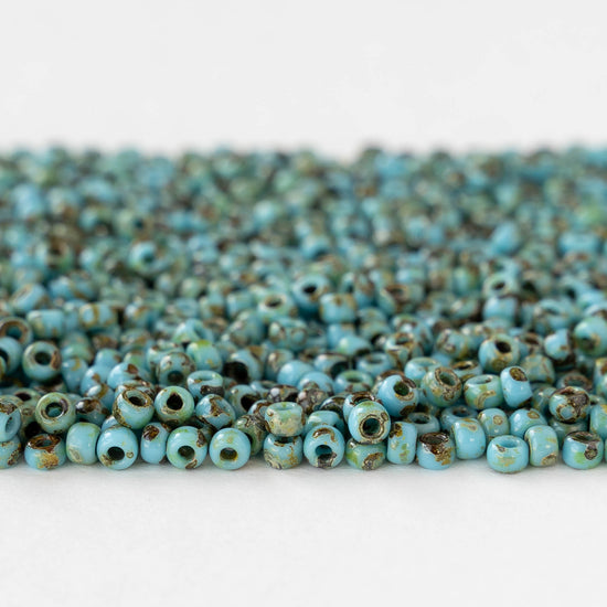 Size 8/0 Glass Seed Beads - Opaque Turquoise Picasso - 10 grams