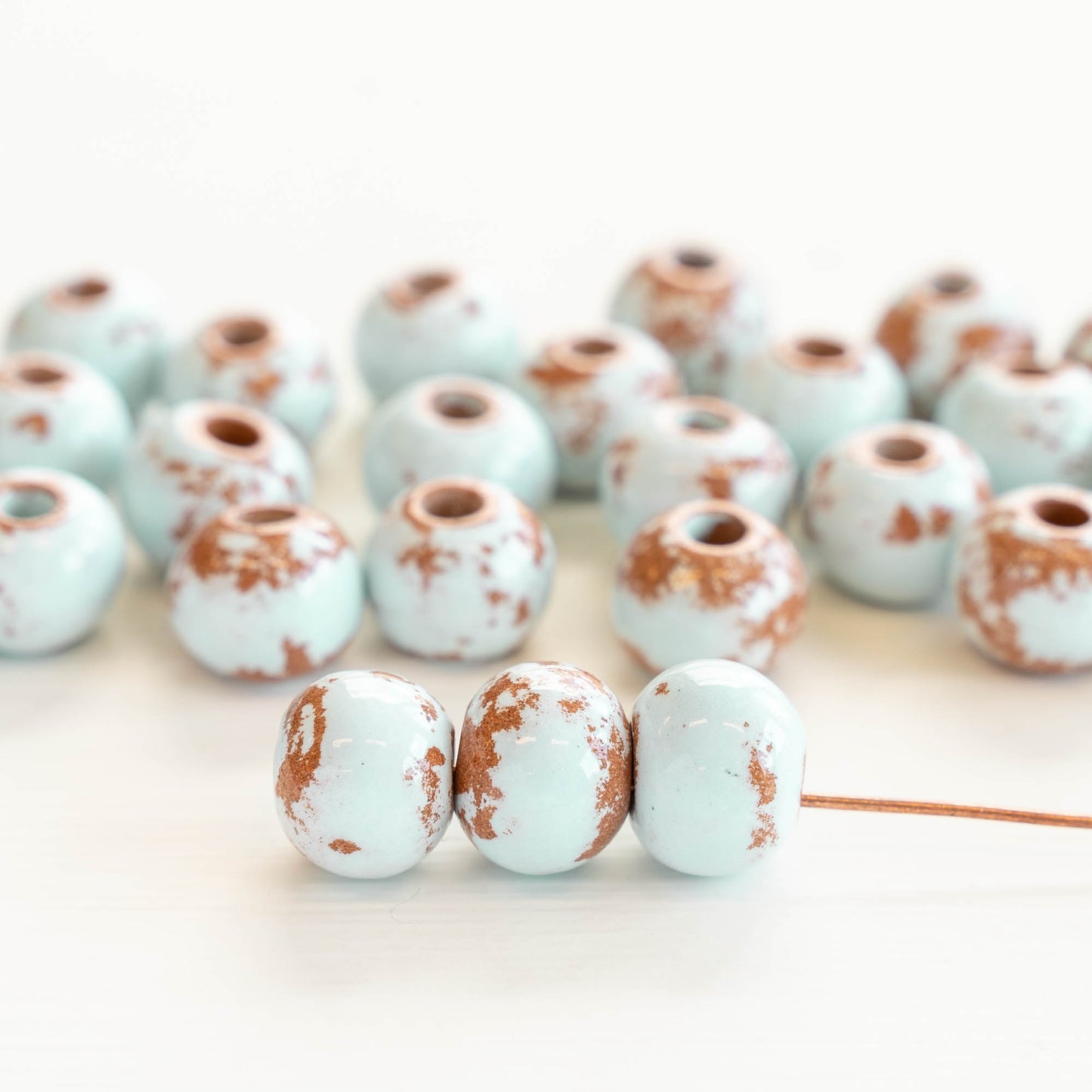 Load image into Gallery viewer, 10x13mm Shiny Glazed Ceramic Round Beads - Baby Blue
