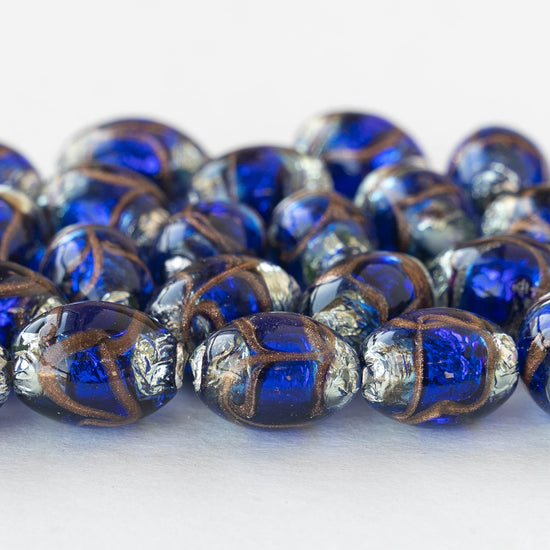 Load image into Gallery viewer, 10x15mm Handmade Oval Lampwork Foil Beads - Cobalt Blue - 2,4 or 8
