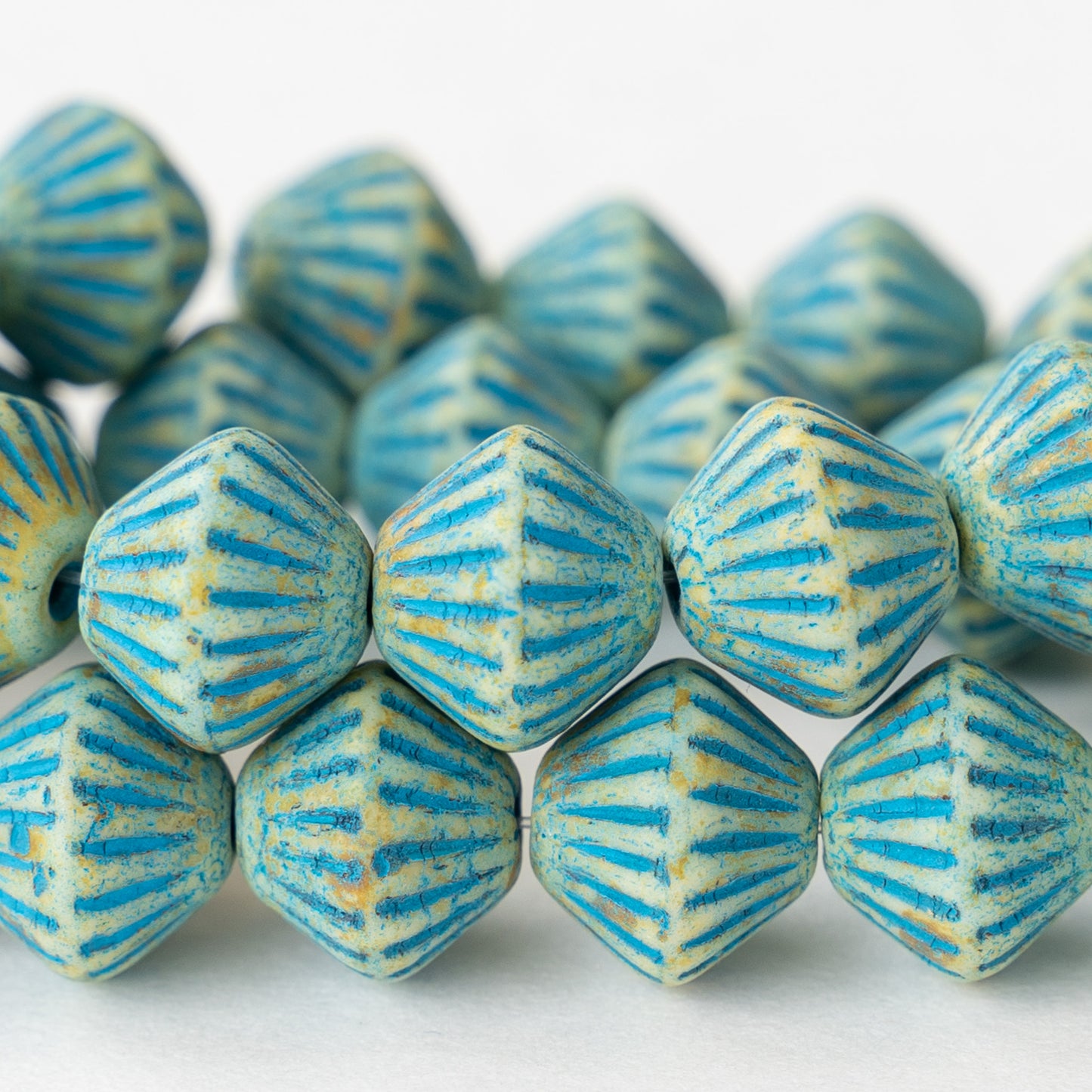 10x11mm Glass Bi-cone - Ivory with Aqua Wash - 15 beads