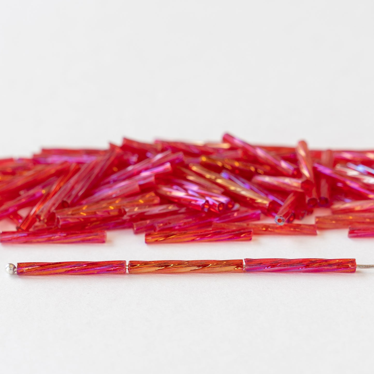 Load image into Gallery viewer, 15mm Twisted Bugle Beads - Magenta AB - 200 Beads
