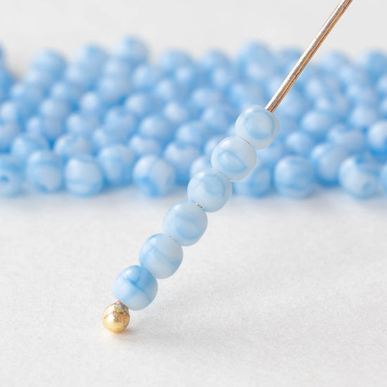 Load image into Gallery viewer, 3mm Round Glass Beads - Light Blue Marble - 120 Beads
