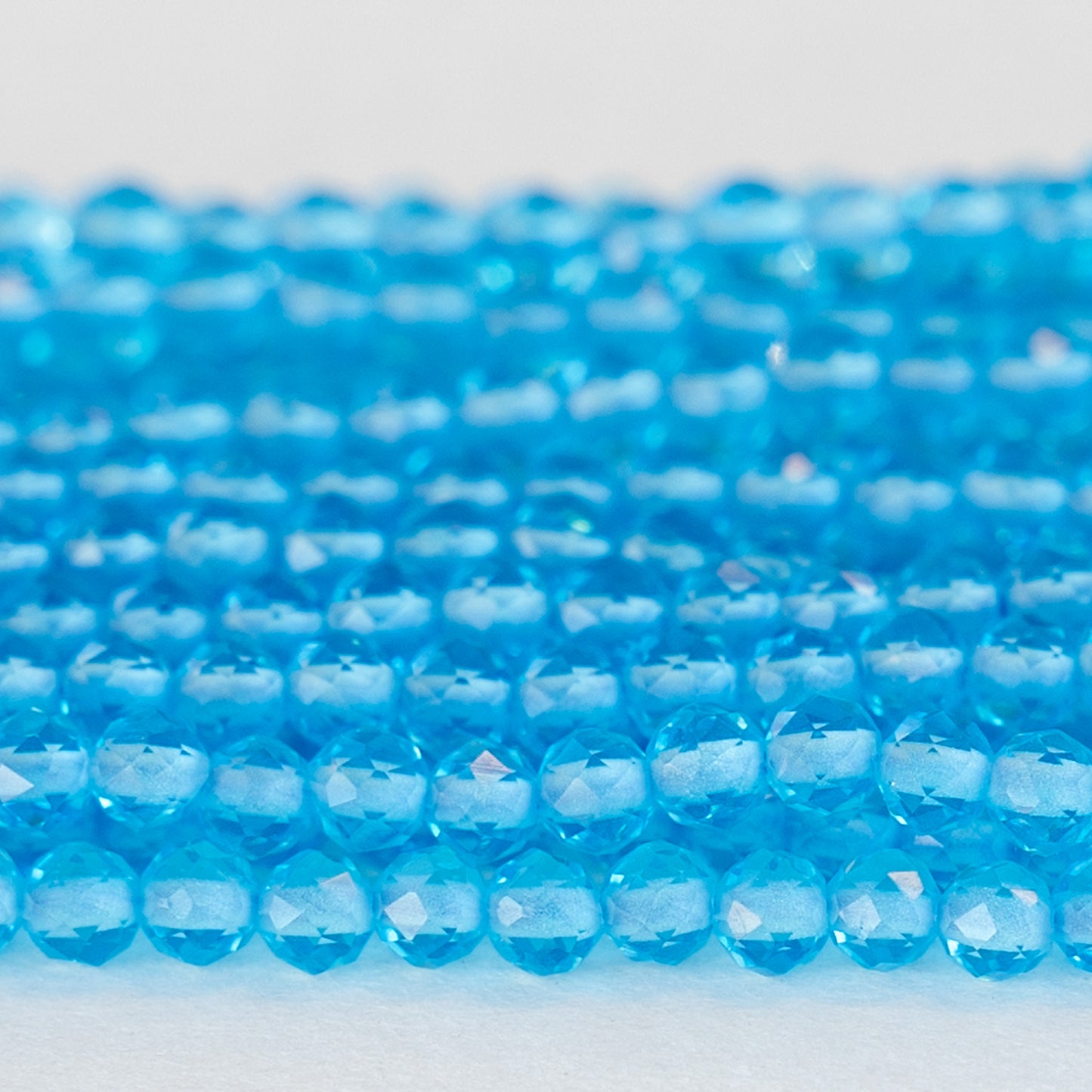 Load image into Gallery viewer, 4mm Faceted Round Crystal Beads - Aqua - 15 Inches
