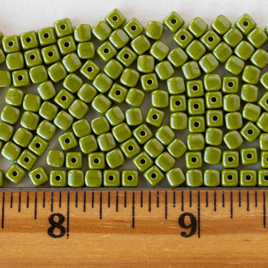 Load image into Gallery viewer, 4mm Glass Cube Beads - Olive Green Luster - 100 beads
