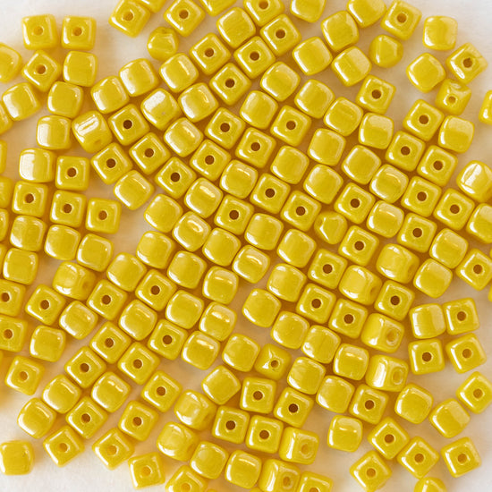 Load image into Gallery viewer, 4mm Glass Cube Beads - Opaque Yellow - 100 beads
