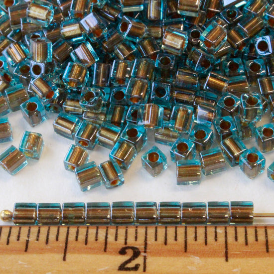 4mm Miyuki Cube Beads  - Gold Line Aqua - 20 or 60 grams