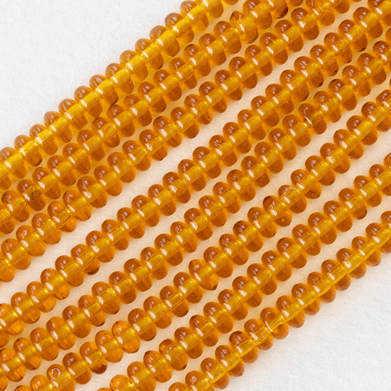 Load image into Gallery viewer, 4mm Rondelle Beads - Medium  Amber Topaz - 100 beads
