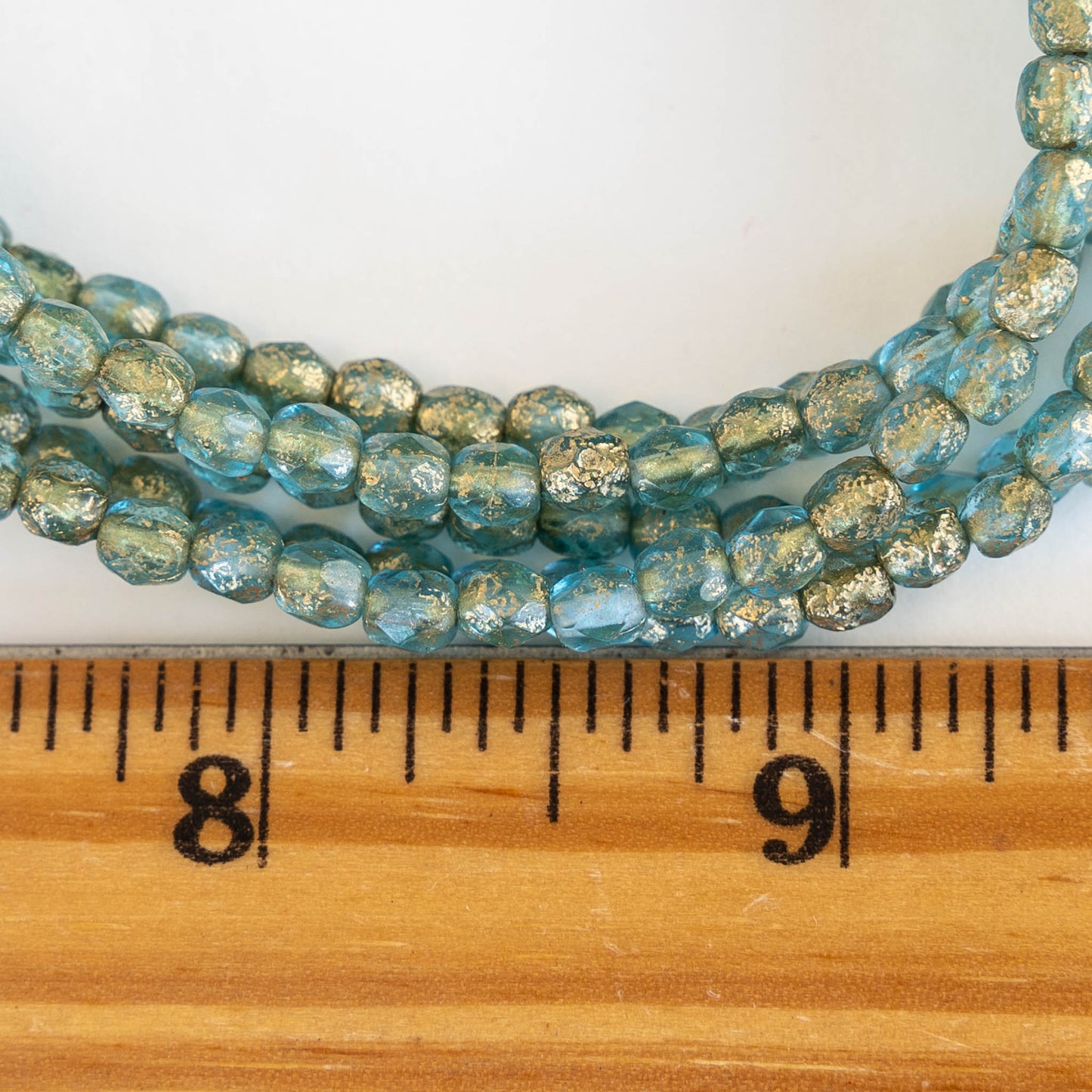 Load image into Gallery viewer, 4mm Round Firepolished Beads - Etched Aqua with Gold Dust - 50 Beads
