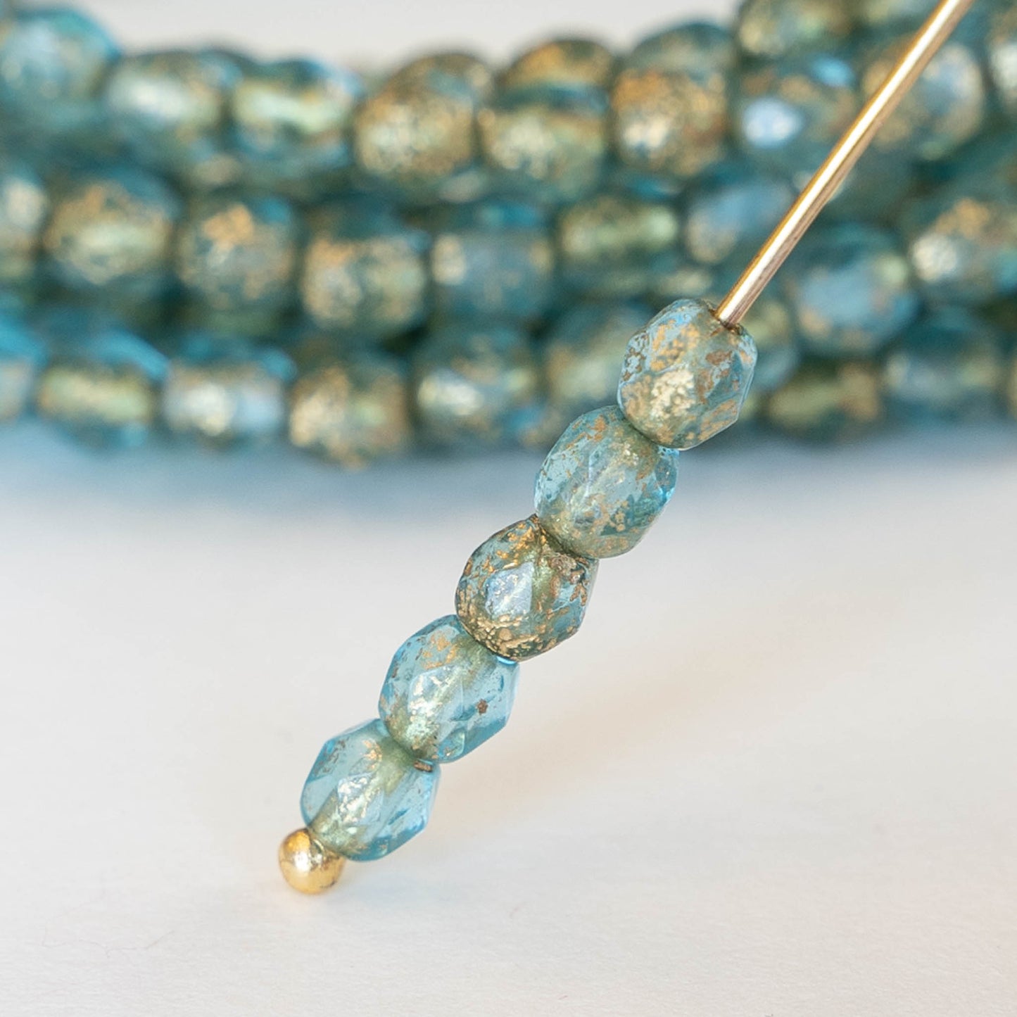 Load image into Gallery viewer, 4mm Round Firepolished Beads - Etched Aqua with Gold Dust - 50 Beads
