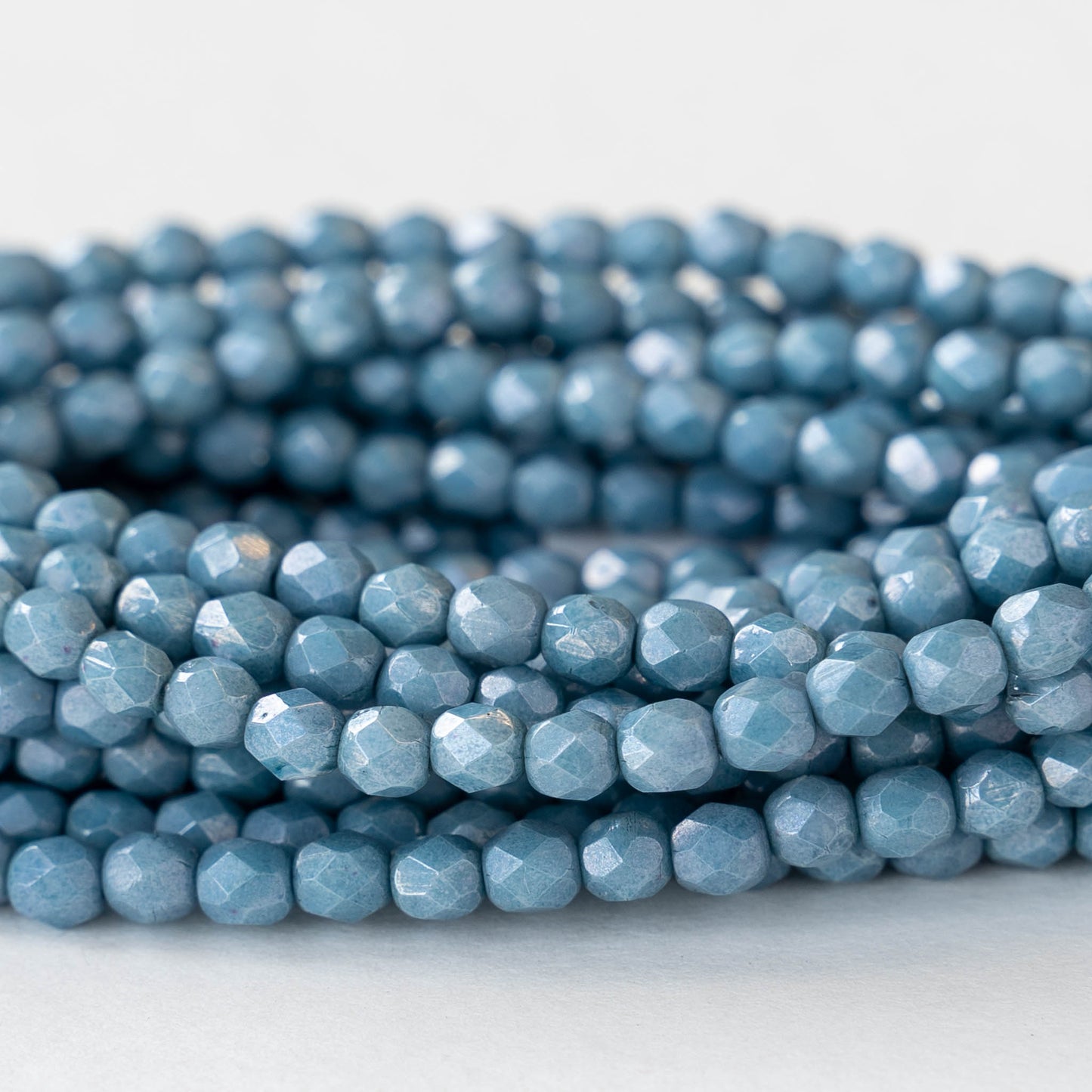 Load image into Gallery viewer, 4mm Round Firepolished Beads - Slate Blue Luster - 50 Beads
