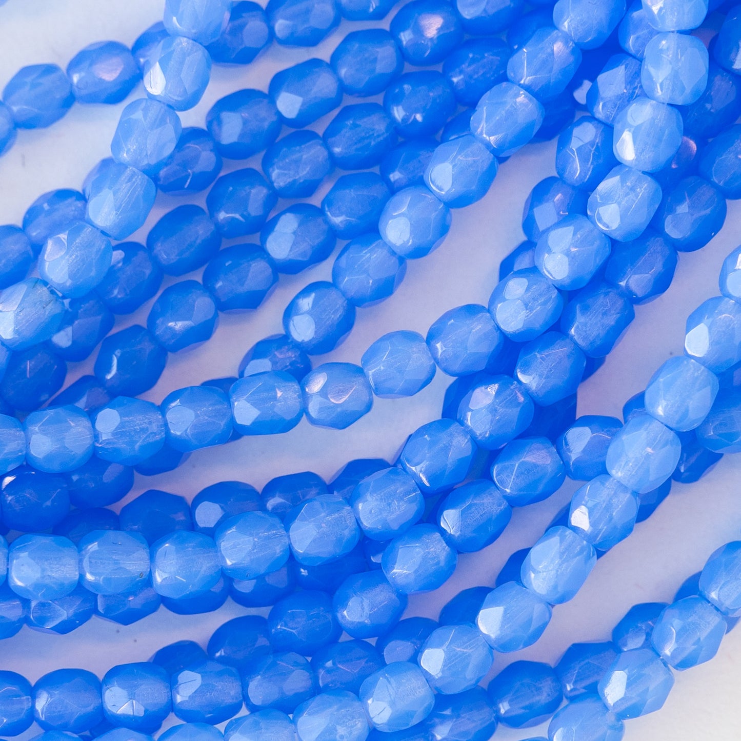 Load image into Gallery viewer, 4mm Round Firepolished Beads - Periwinkle Blue Opaline - 50 beads
