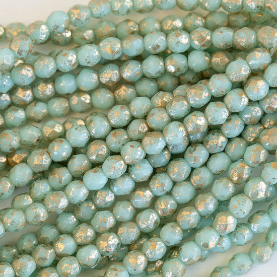 Load image into Gallery viewer, 4mm Round Firepolished Beads -  Mint with Gold Finish - 50 Beads
