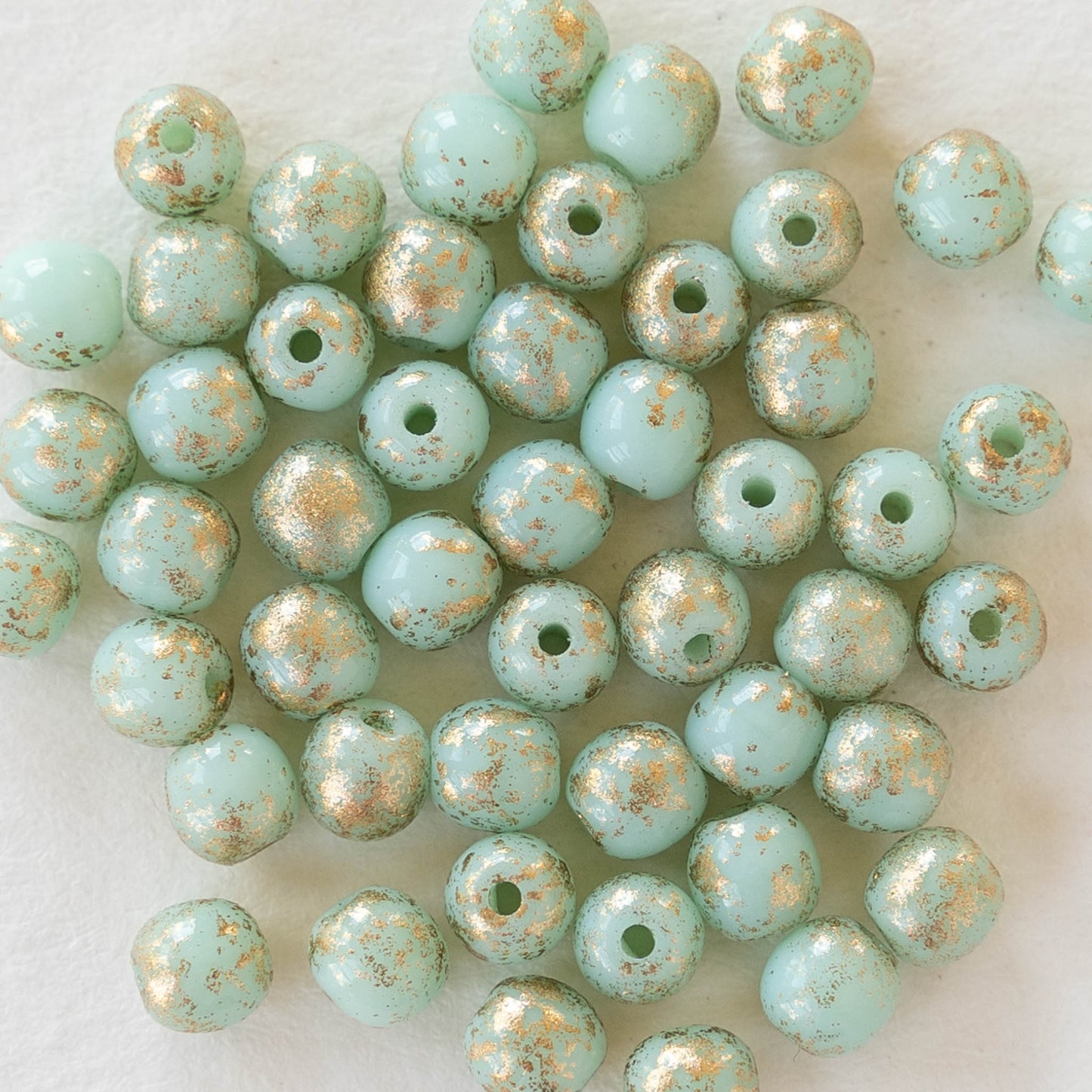Load image into Gallery viewer, 4mm Round Glass Beads - Mint Green with Gold Finish - 50 Beads
