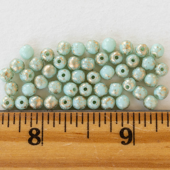 Load image into Gallery viewer, 4mm Round Glass Beads - Mint Green with Gold Finish - 50 Beads
