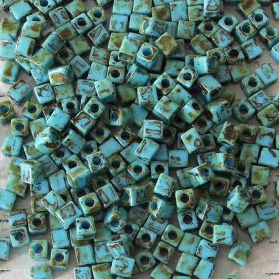 Load image into Gallery viewer, 4mm Miyuki Cube Beads - Turquoise Picasso - 20 or 60 grams
