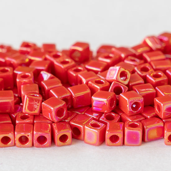 Load image into Gallery viewer, 4mm Miyuki Cube Beads  - Red Coral Luster - 20 or 60 grams
