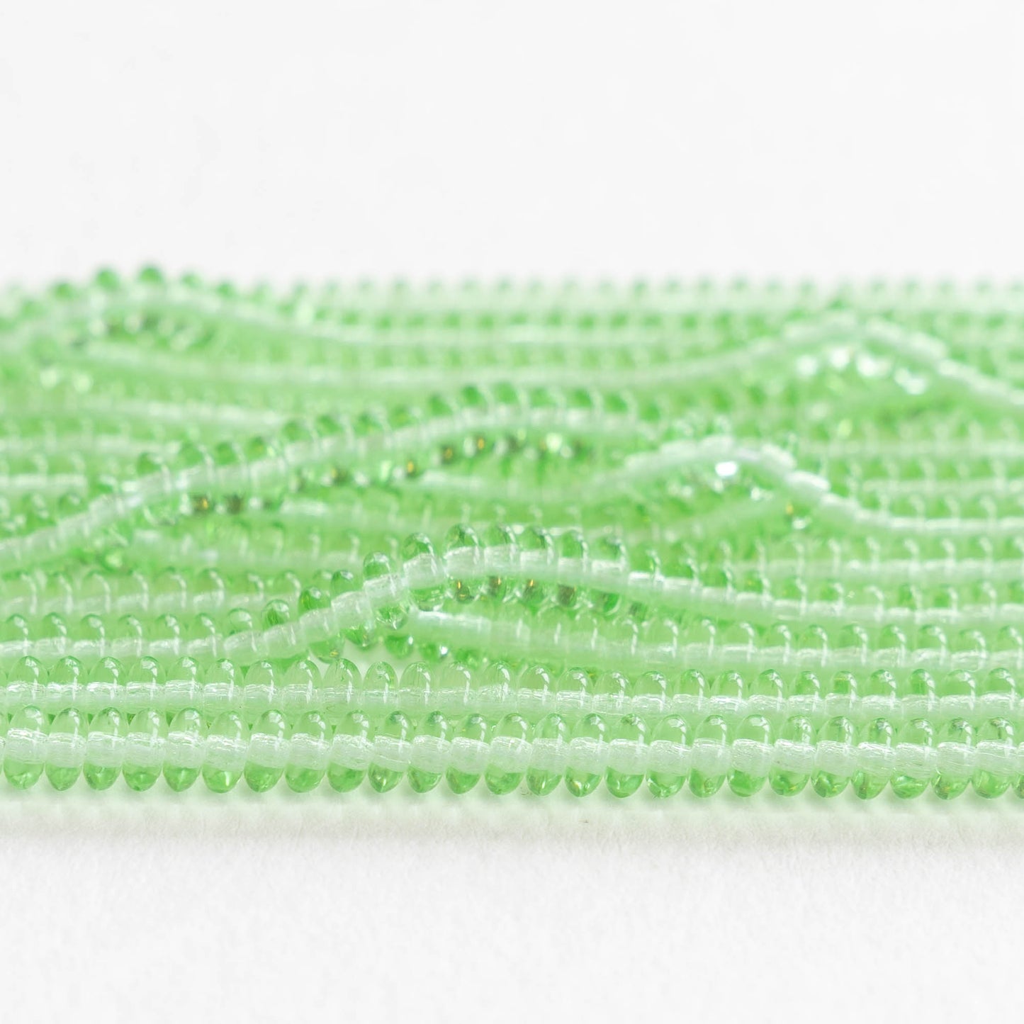 Load image into Gallery viewer, 4mm Rondelle Beads - Peridot Green - 100 Beads
