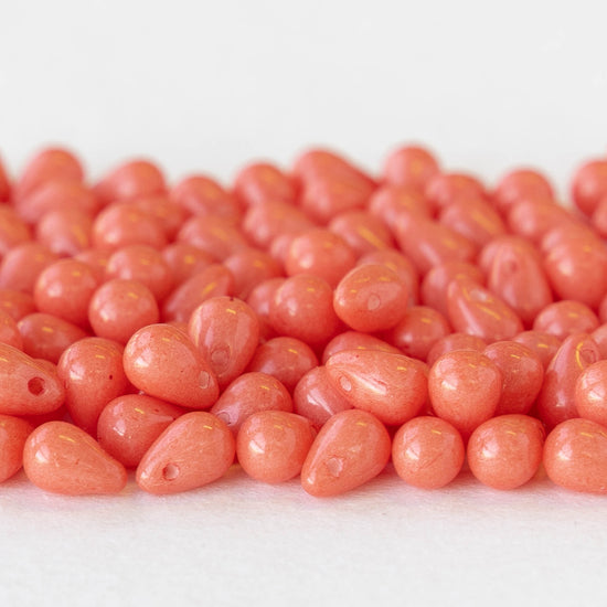 Load image into Gallery viewer, 4x6mm Glass Teardrop Beads - Coral - 100 Beads
