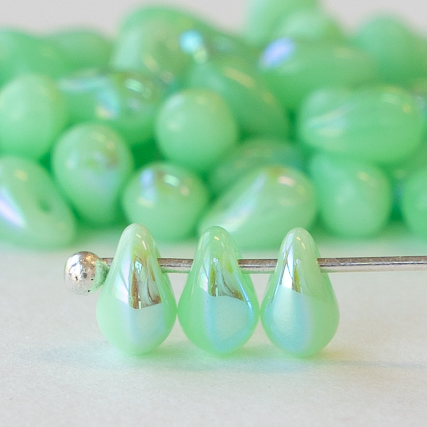 Load image into Gallery viewer, 4x6mm Glass Teardrops - Jade Green AB - 100 Beads
