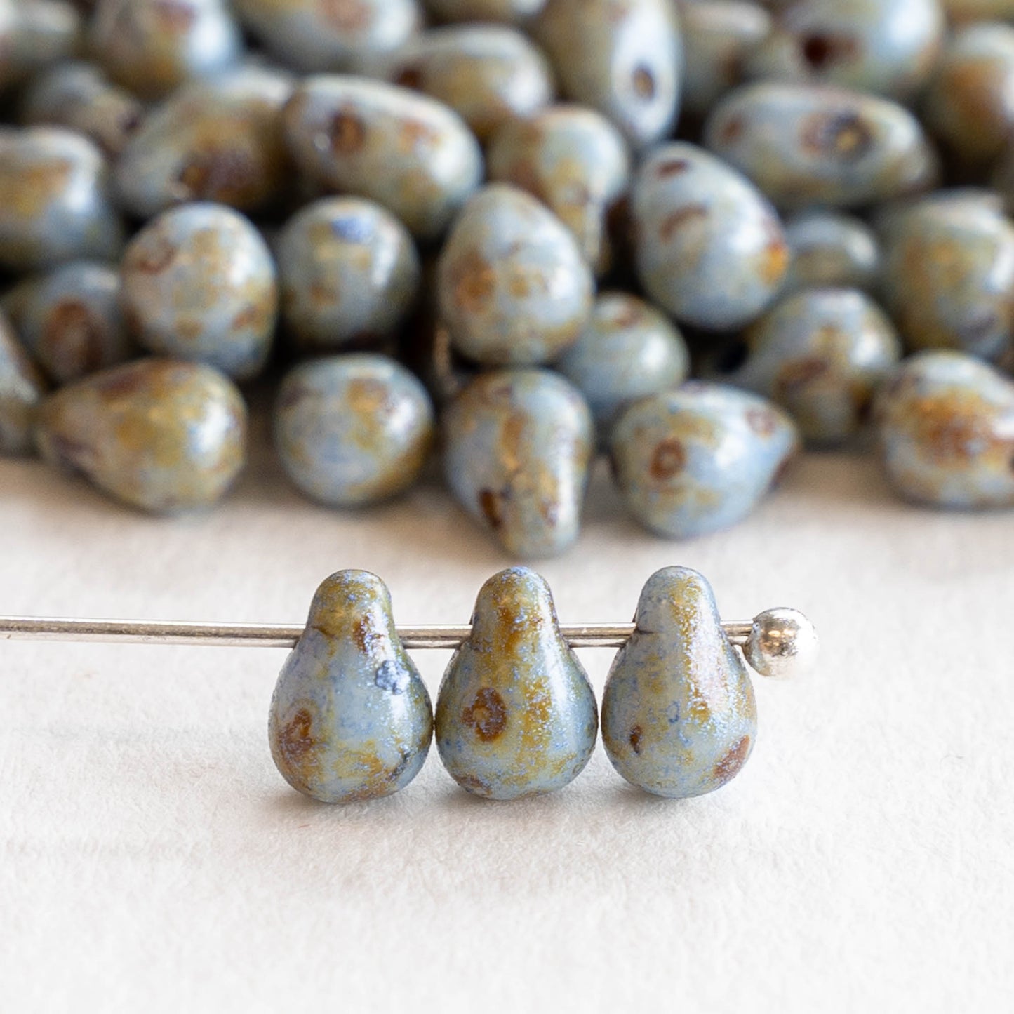 Load image into Gallery viewer, 4x6mm Teardrop Beads - Baby Blue Picasso - 100 Beads
